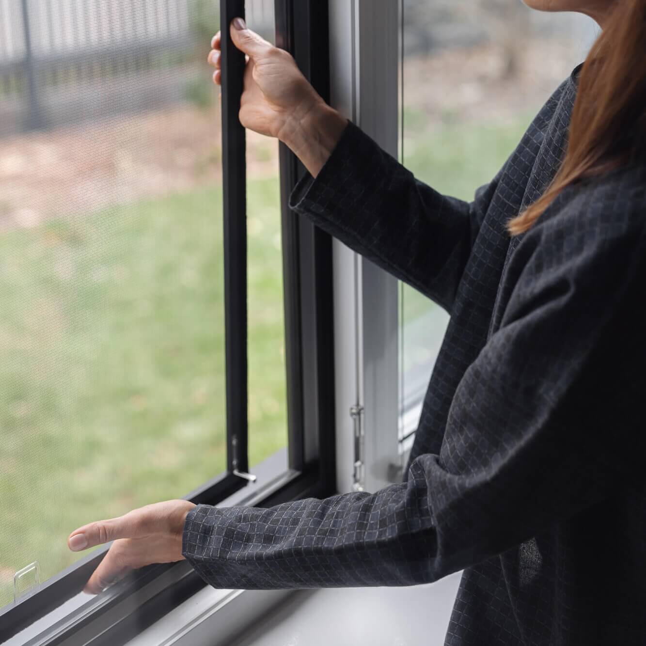 A person slides up the glass, revealing the Insect screen window – in frame.